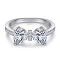 Damen Designer-Ring mit Schleifenmotiv und funkelnden Zirkonia Shop Nory