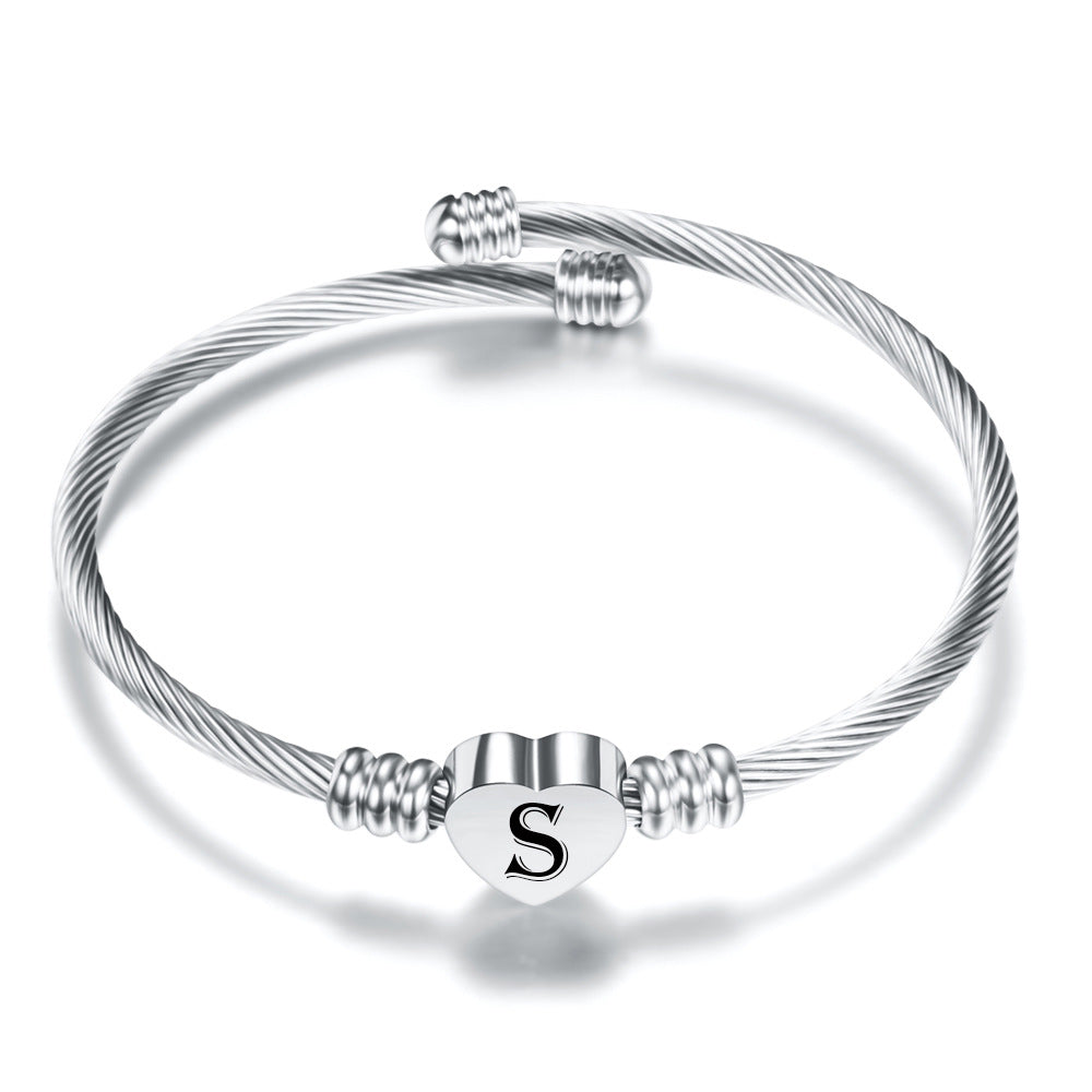Damen Armreif mit herzförmigem Anhänger und eleganten Akzenten Shop Nory