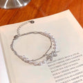 Damen Armband mit zartem Perlendetail und charmantem Anhänger Shop Nory