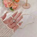 Damen Armband mit handgefertigten Perlen und herzförmigem Anhänger Shop Nory