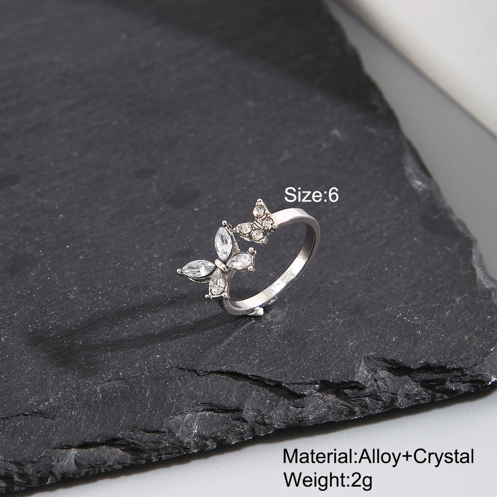 Damenring mit funkelndem Schmetterlingsdesign und eleganten Details Shop Nory