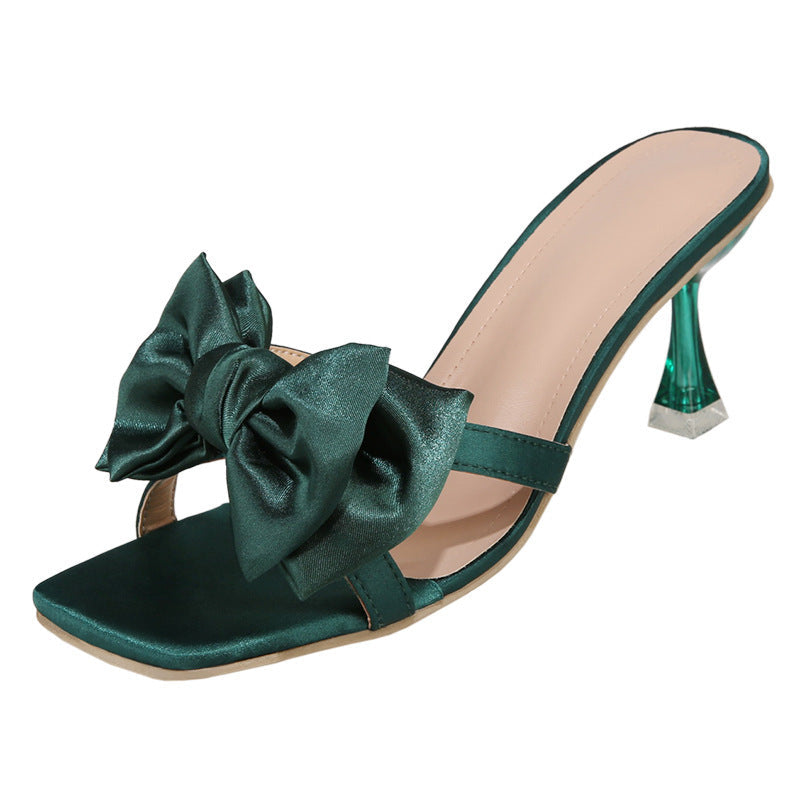 Damen High Heel Pantoletten mit eleganter Schleifen-Applikation und glitzerndem Absatz