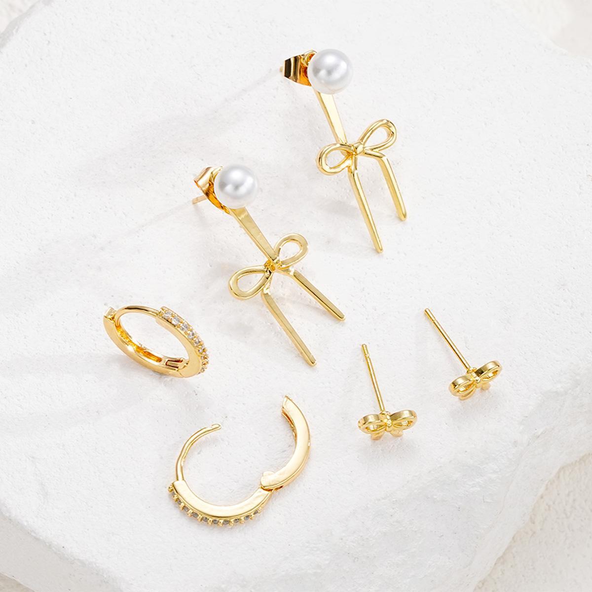 Damen Ohrstecker-Set mit funkelnden Schmuckelementen und eleganten Schleifen Shop Nory