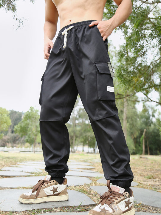 Herren Multifunktionale Cargo-Joggerhose mit elastischem Tunnelzugbund, verschließbaren Beintaschen und verstärkten Knieeinsätzen Shop Nory