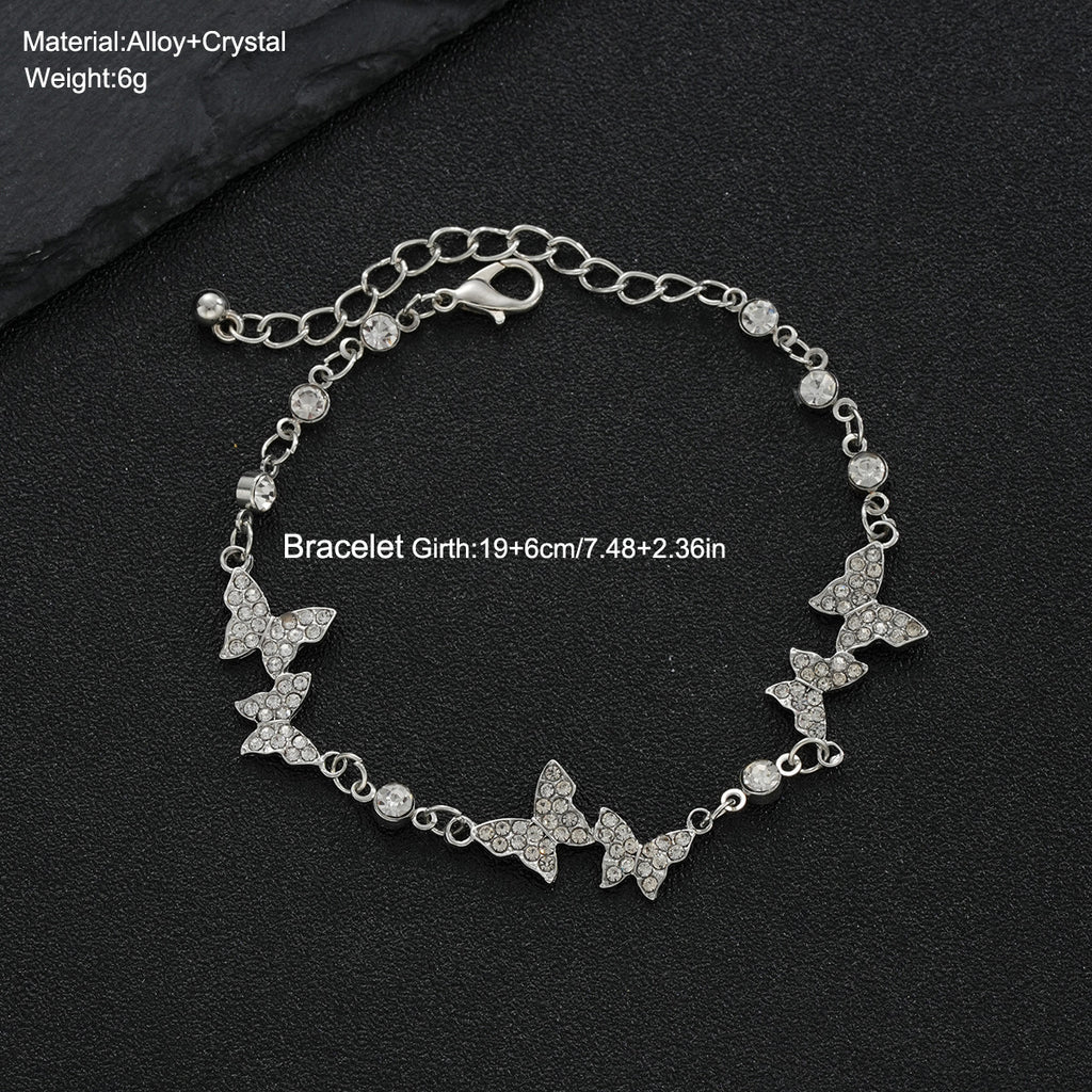Damenarmband mit funkelnden Schmetterlingen Shop Nory