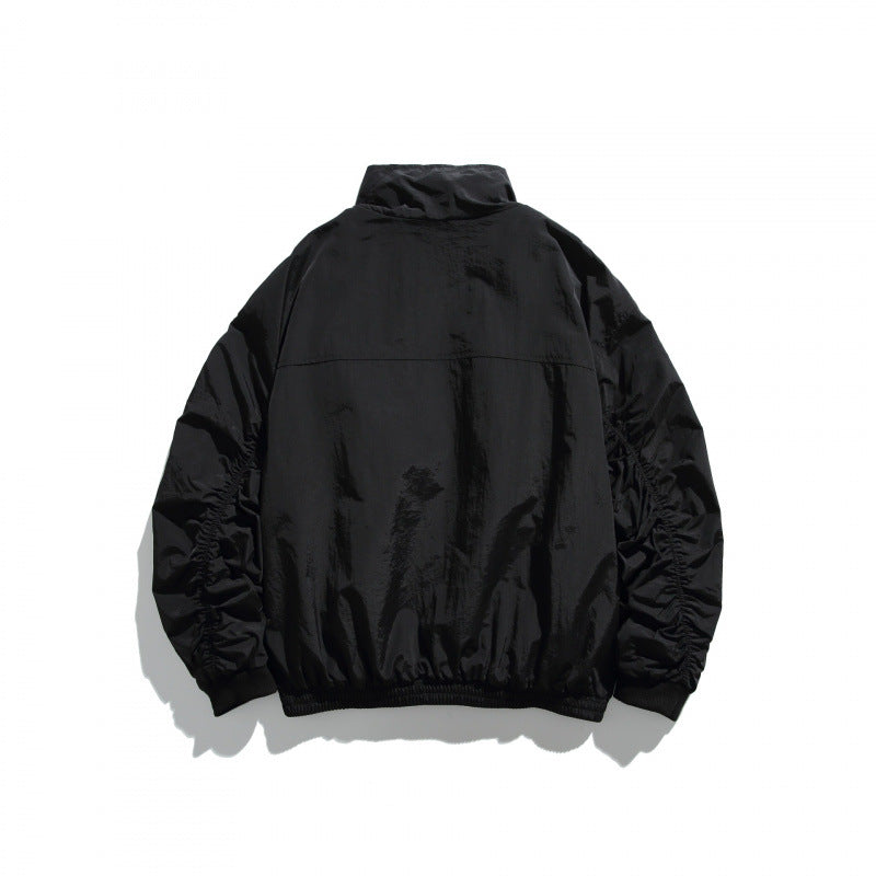 Unisex Leichte Nylon‑Bomberjacke mit Stehkragen, durchgehendem Reißverschluss und elastischem Saum Shop Nory