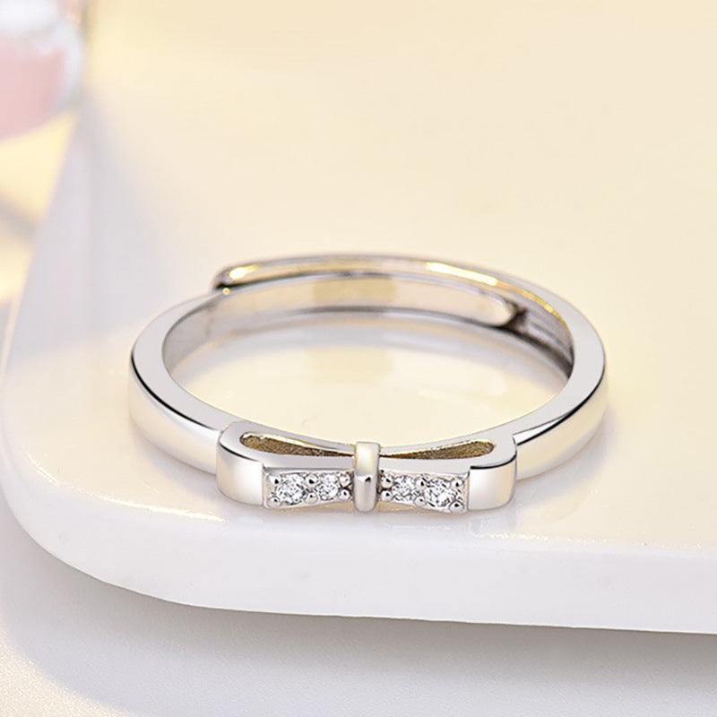 Damenring mit kunstvollem Schleifenmotiv und funkelnden Zirkonia-Details Shop Nory