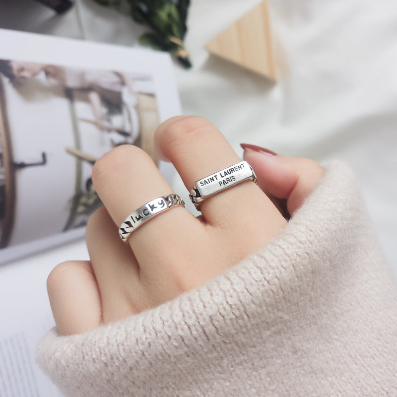 Damen Offener Ring mit geflochtenem Design und markantem Schriftzug Shop Nory
