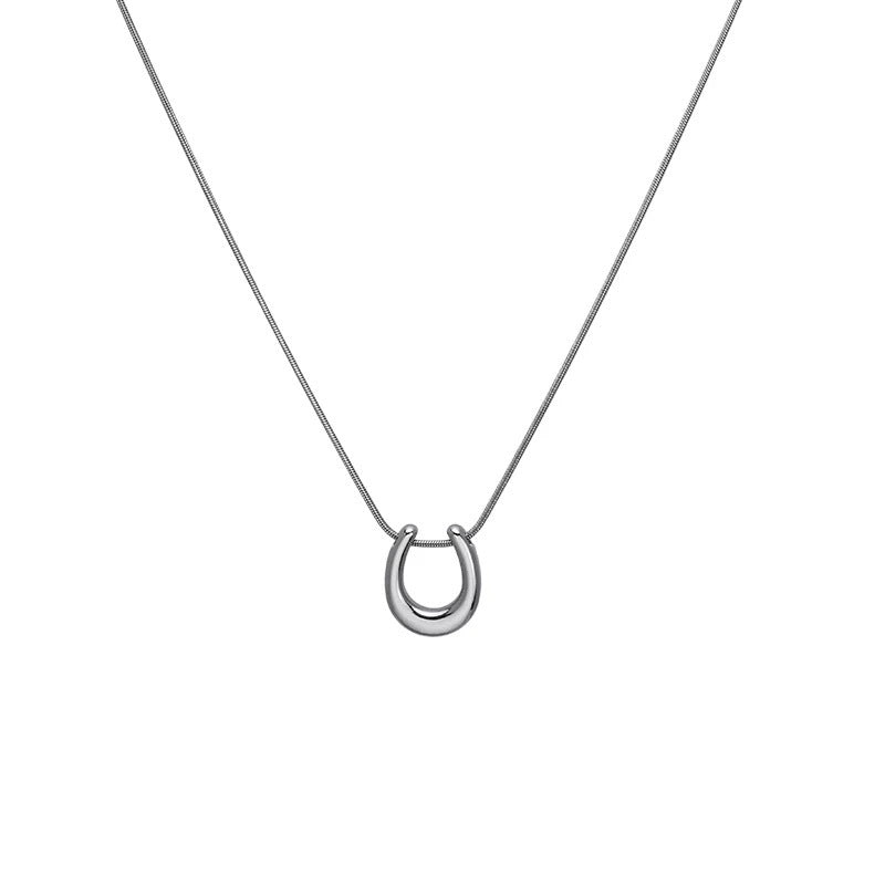 Damen Halskette mit modernem, geschwungenem Anhänger aus Edelstahl Shop Nory