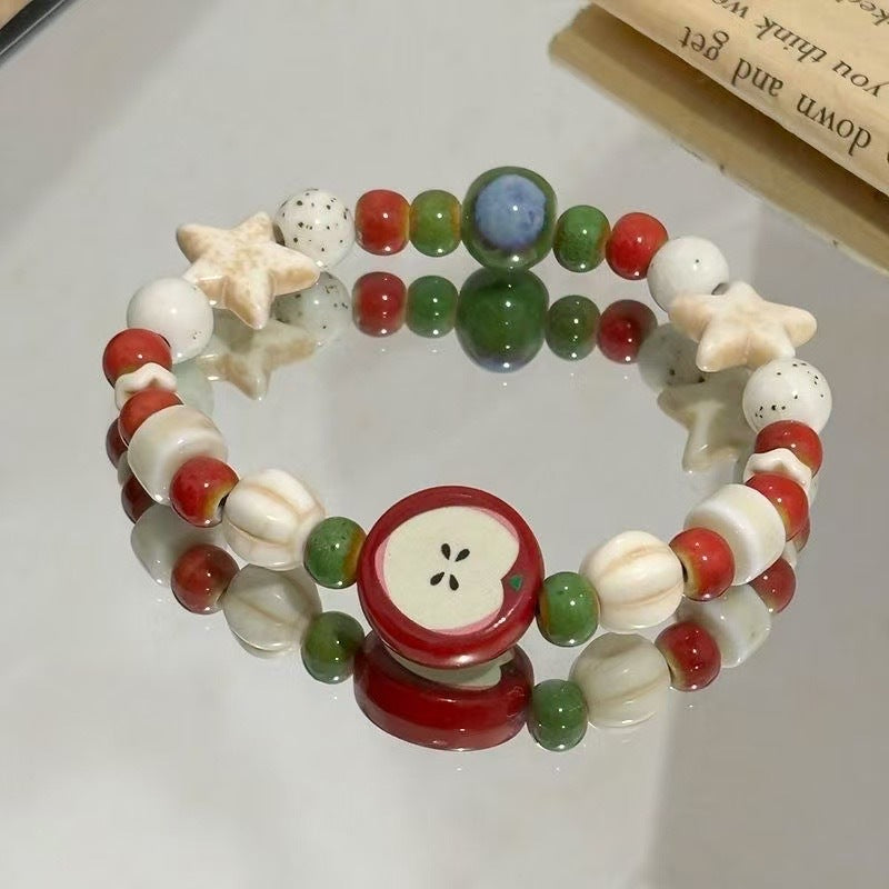 Damen Armband aus handgefertigten bunten Naturperlen und stilvollen Anhängern Shop Nory