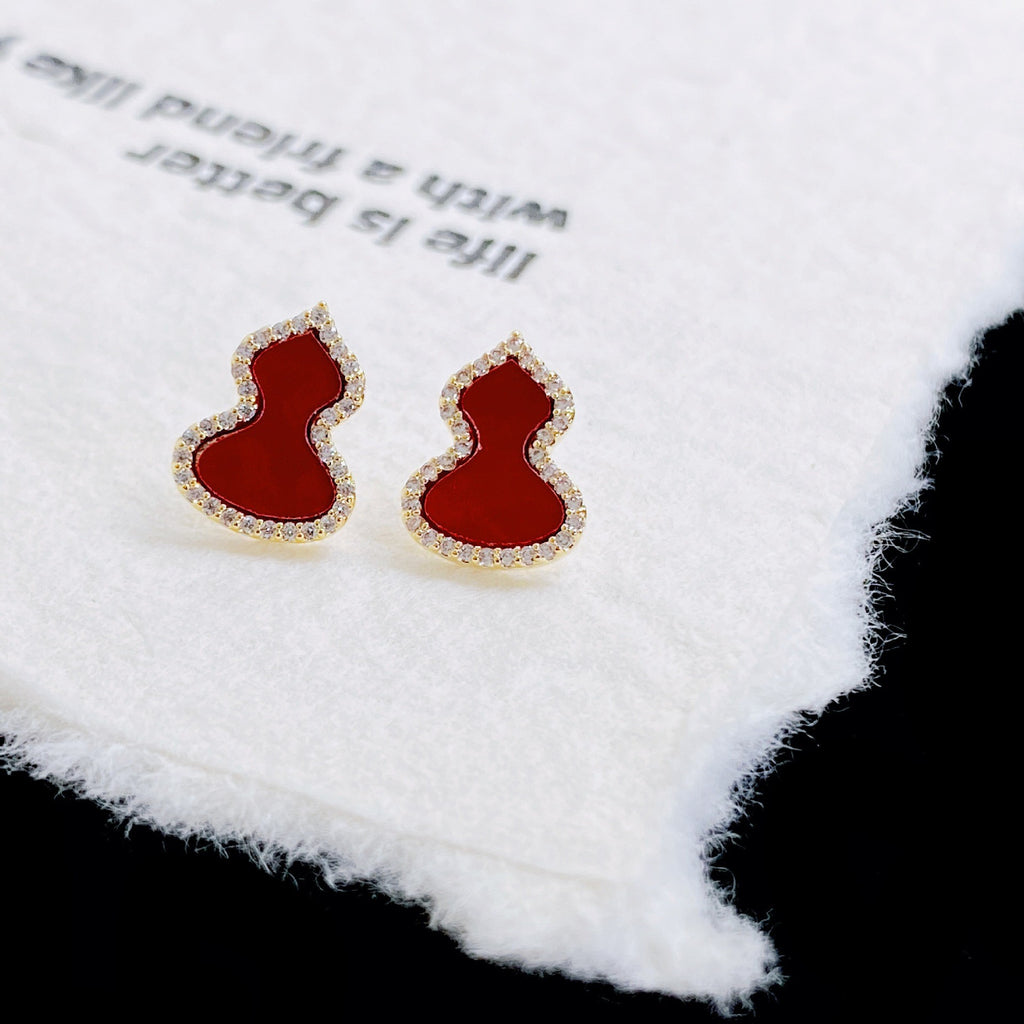 Damen Ohrringe mit kunstvollem Design und funkelndem Zirkonia Shop Nory