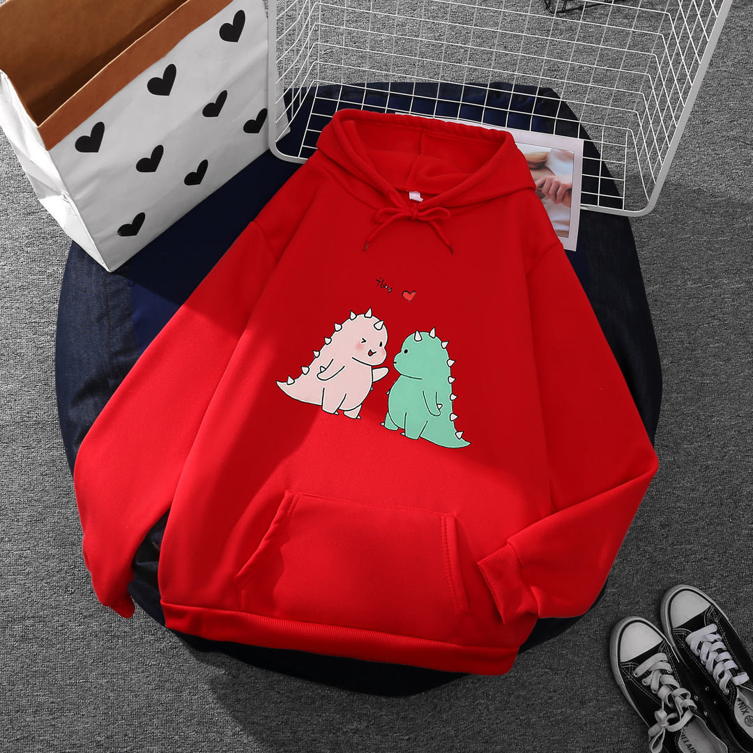 Damen nan Kapuzenpullover mit niedlicher Dinosaurierpärchen‑Illustration, Oversize‑Schnitt und Kängurutasche Shop Nory