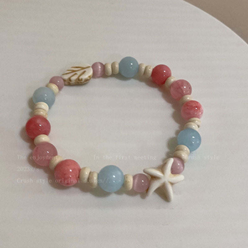 Damen Armband aus handgefertigten Natursteinen mit charmanten Tiermotiven Shop Nory