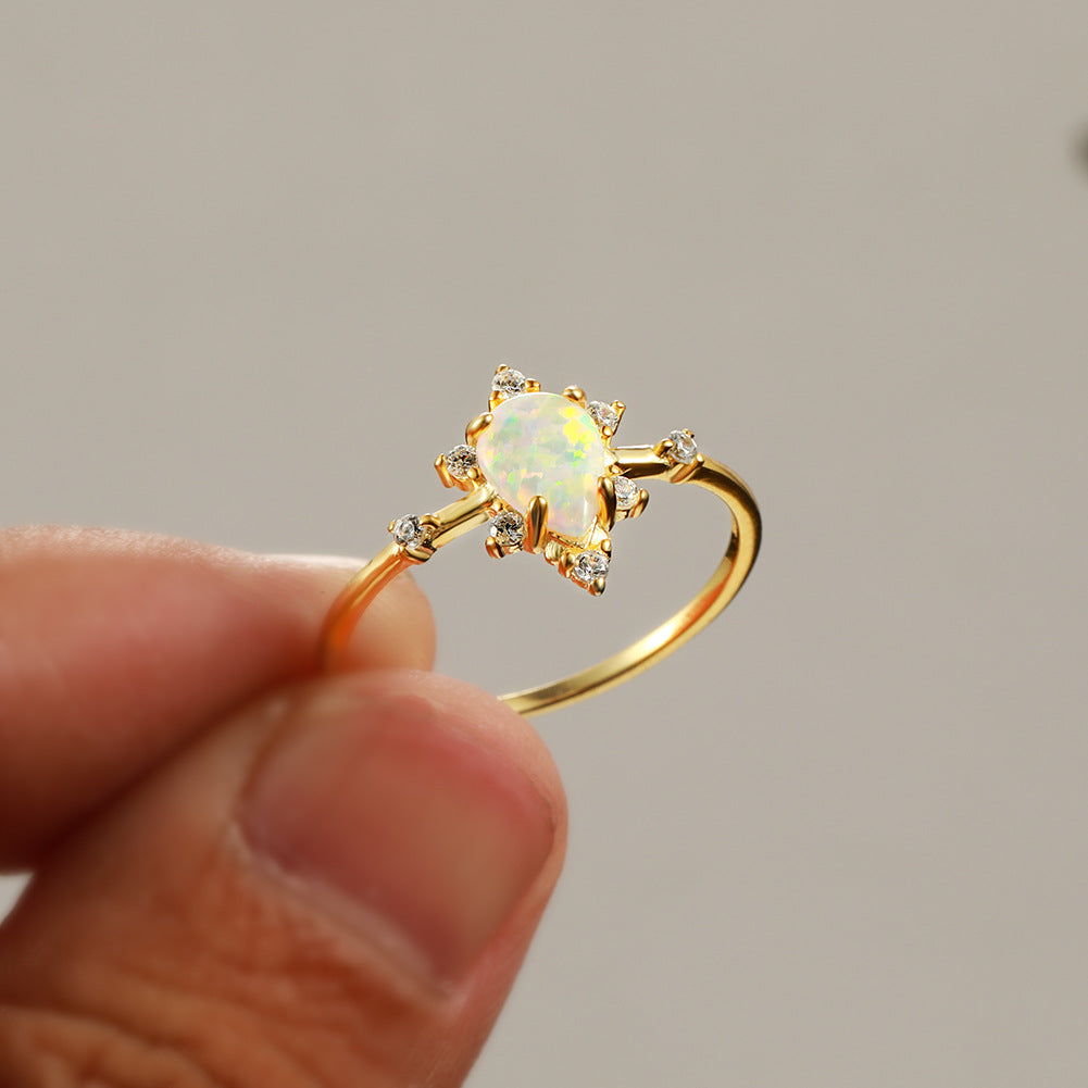 Damen Ring mit funkelndem Tropfen-Opal und elegantem Zirkonia-Design Shop Nory