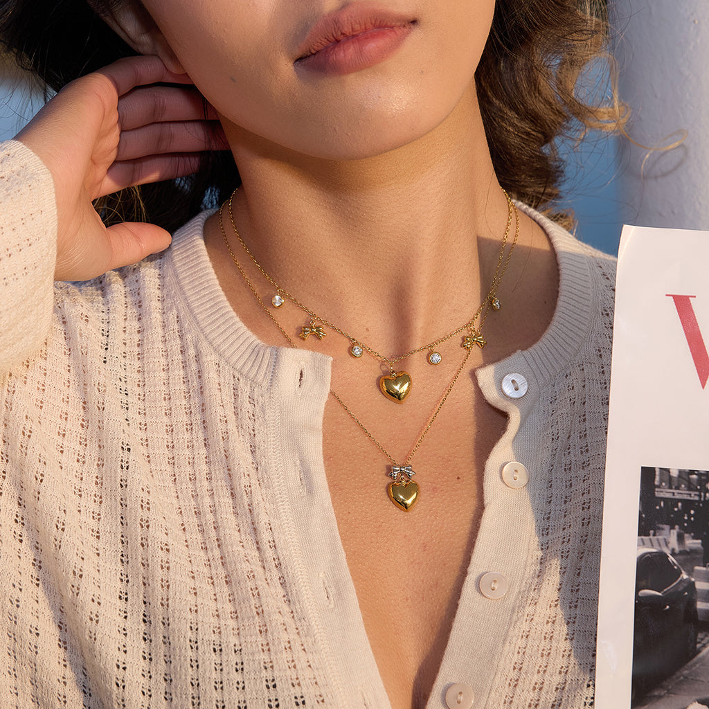 Damen Anhänger in Herzform mit Schleifenmotiv aus hypoallergenem Edelstahl Shop Nory