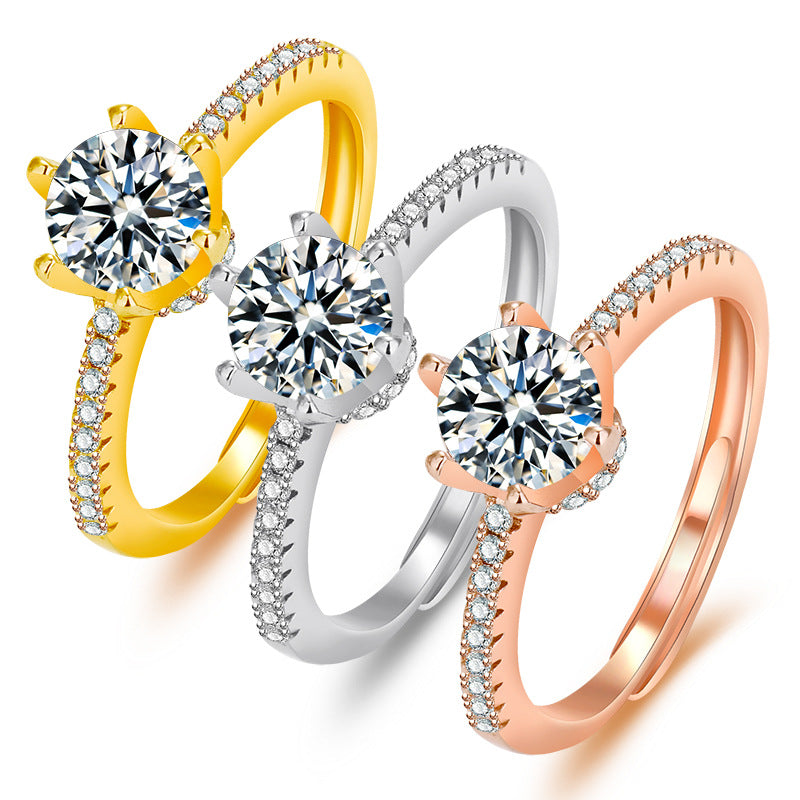 Damenring mit funkelndem Zirkonia und eleganten Goldverzierungen Shop Nory