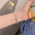 Damenarmband mit funkelnden Herz- und Kristallelementen Shop Nory