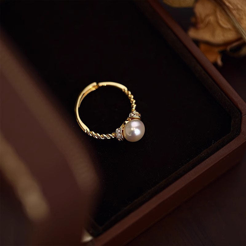 Damen eleganter Ring mit kunstvoll geflochtenem Design und edler Perle Shop Nory