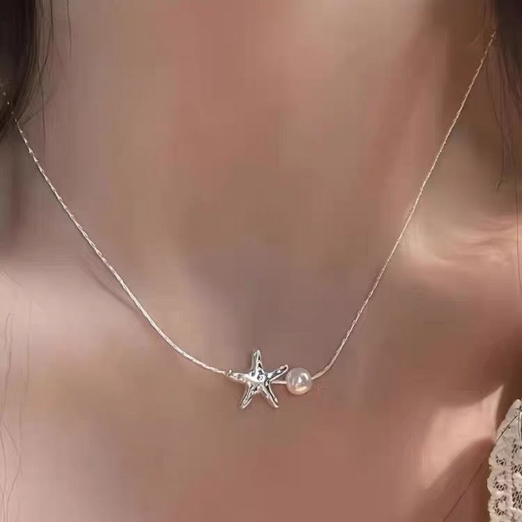 Damen Kette mit verspieltem Seestern-Anhänger und eleganter Perle Shop Nory