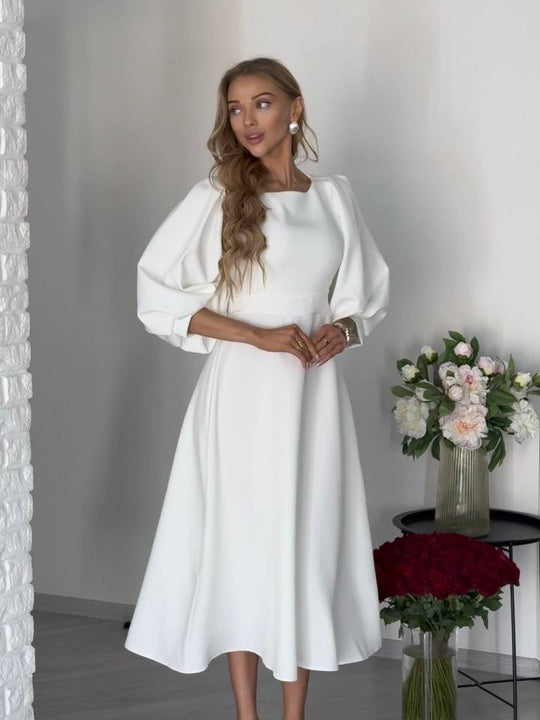 Damen Midikleid mit offenem Rückenausschnitt, voluminösen Puffärmeln und Bindegürtel Shop Nory
