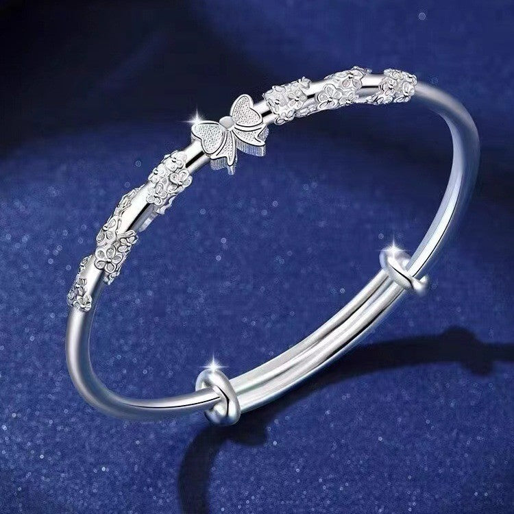 Damen Armband mit floralen und schimmernden Details Shop Nory
