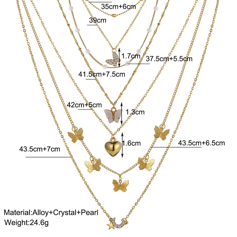 Damen Halskette Set aus feinen goldenen Ketten mit verspielten Anhängern Shop Nory