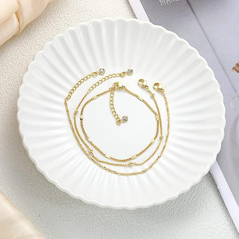 Damen zartes Fußkettchen-Set mit feinen Glieder- und funkelnden Zirkonia-Details Shop Nory