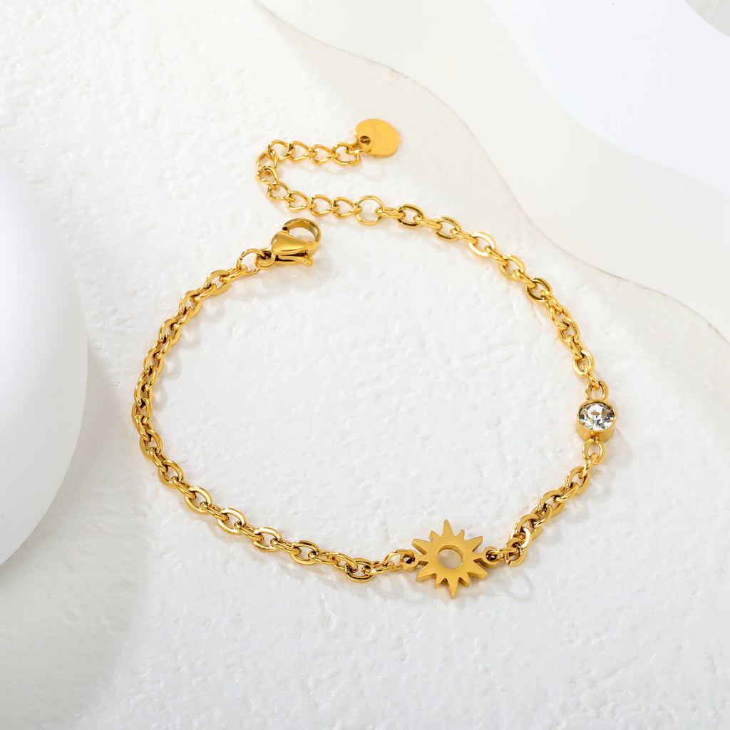 Damen Armband mit funkelndem Sonnensymbol und eleganter Gliederkette Shop Nory
