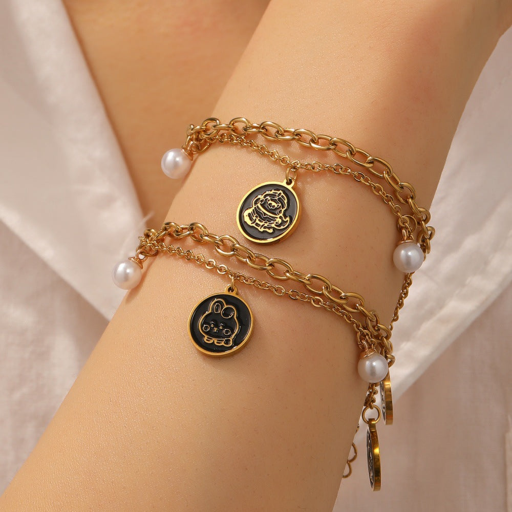 Damen Armband mit charmantem Anhänger und eleganten Perlen Shop Nory