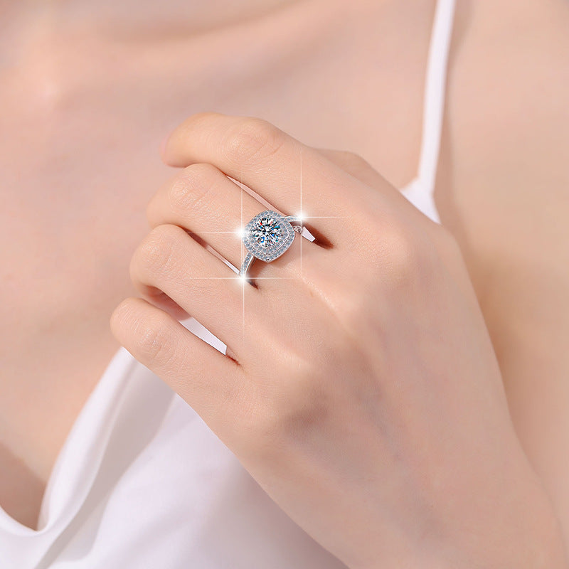 Damenring mit quadratischem Hauptstein und funkelndem Zirkonia-Rahmen Shop Nory