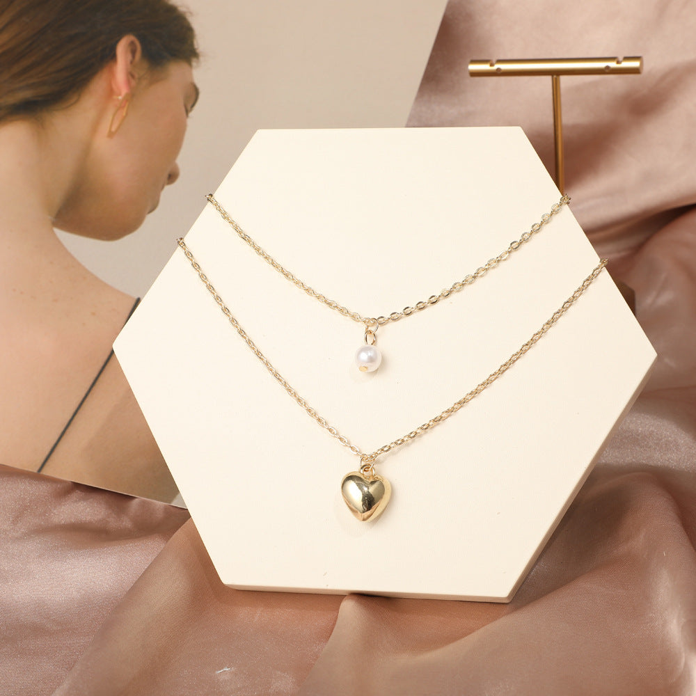 Damen Halskette mit herzförmigem Anhänger und Perlenakzent Shop Nory