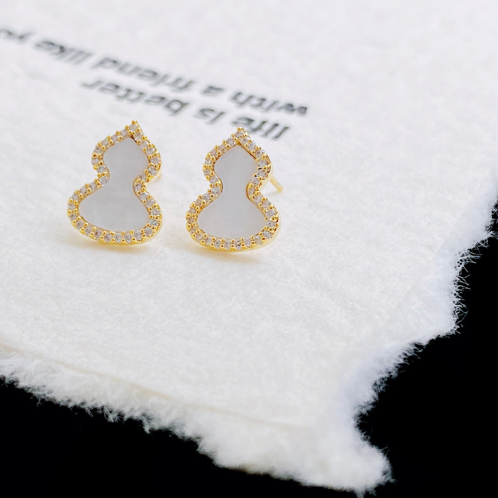 Damen Ohrringe mit kunstvollem Design und funkelndem Zirkonia Shop Nory