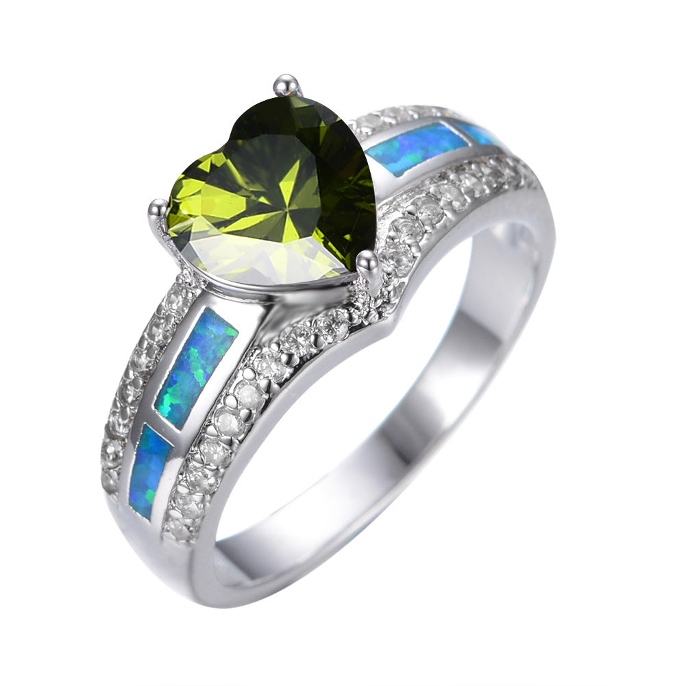 Damen Ring mit herzförmigem smaragdgrünem Stein und feinen Zirkonia-Details Shop Nory