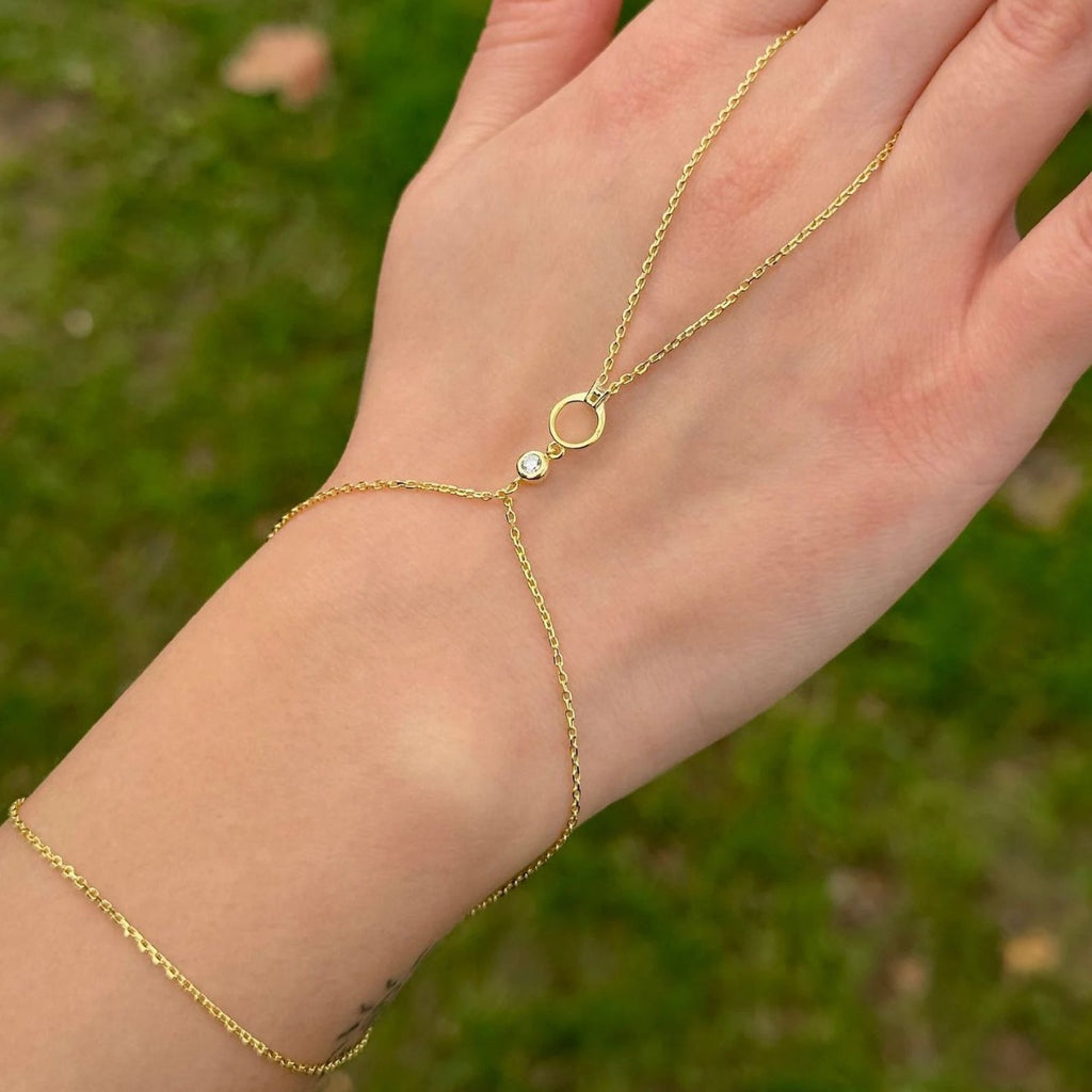 Damen Handkette mit elegantem Wellen-Design und funkelnden Zirkonia-Elementen Shop Nory