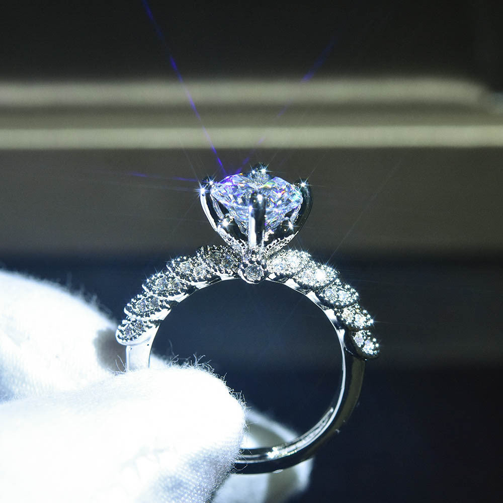 Damen Verlobungsring mit funkelndem Diamant und filigraner Fassung Shop Nory
