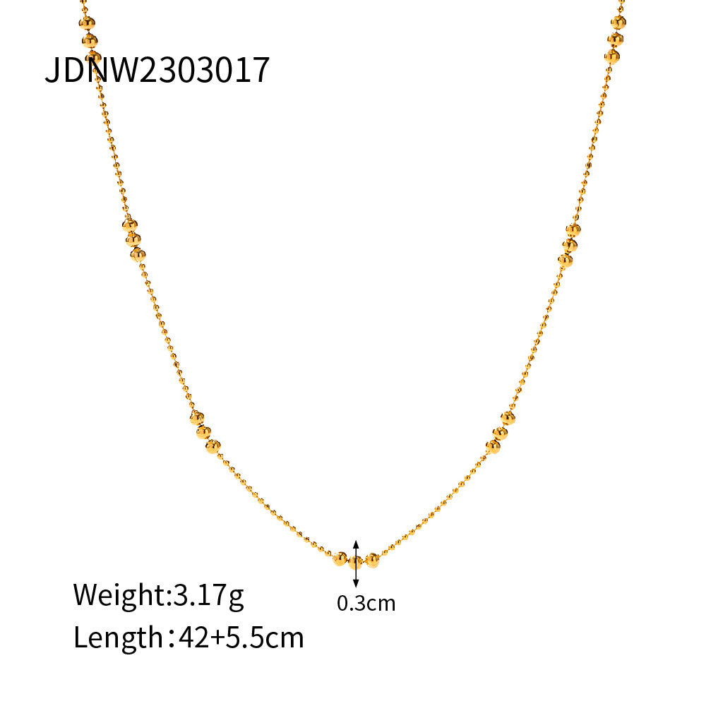 Damen Halskette mit schimmernden goldenen Kugeldetails Shop Nory