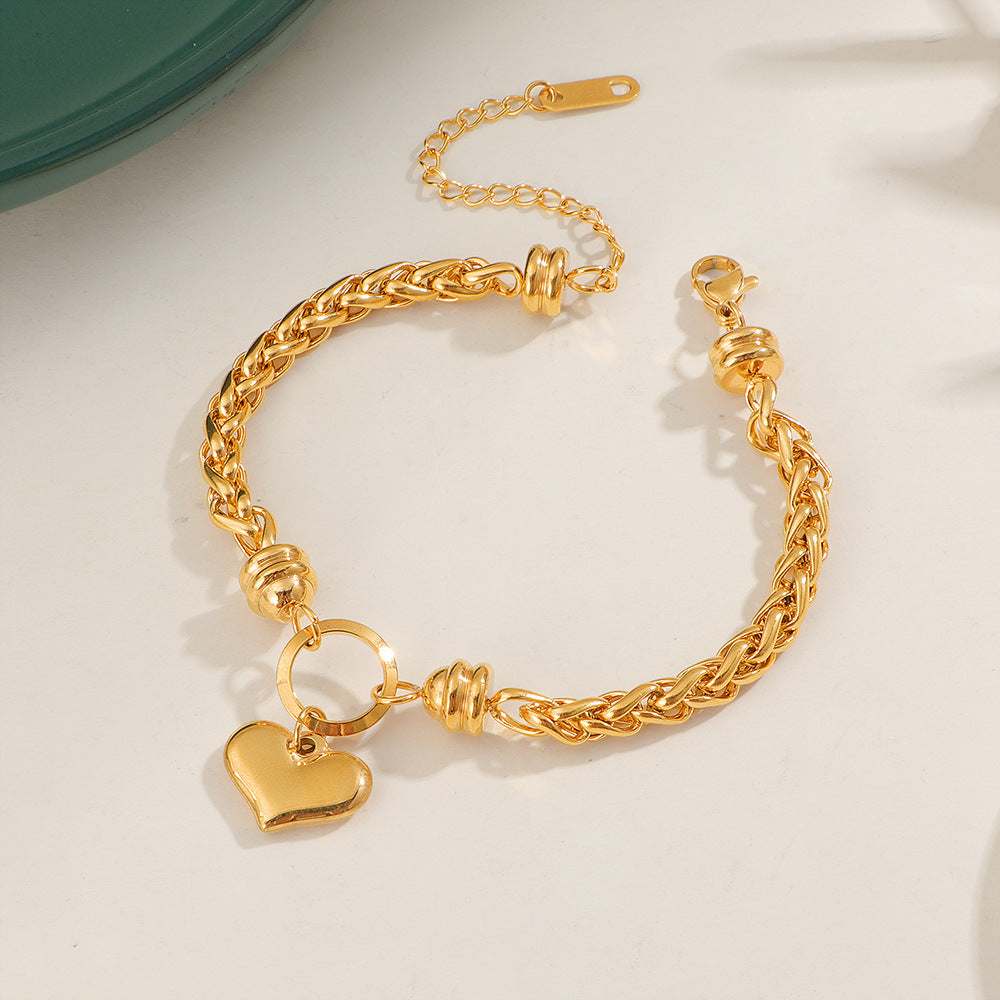 Damen liebevolles Armband mit herzförmigem Anhänger und kunstvollem Geflecht Shop Nory