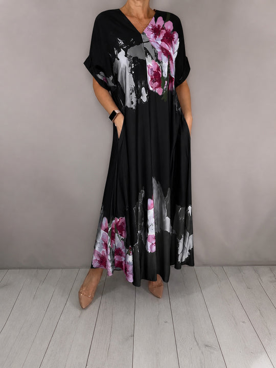 Damen Maxikleid mit weitem Fall, V-Ausschnitt, Eingrifftaschen und floraler Aquarelloptik Shop Nory