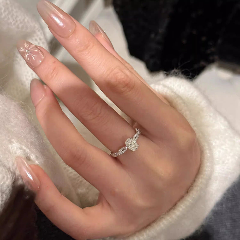 Damen Ring mit funkelndem Zirkonia und zeitlosem Wellenmuster Shop Nory
