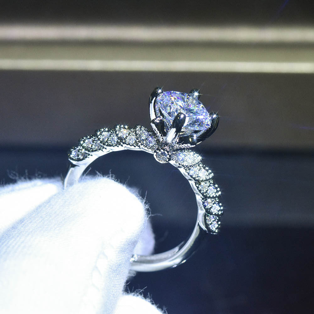 Damen Verlobungsring mit funkelndem Diamant und filigraner Fassung Shop Nory