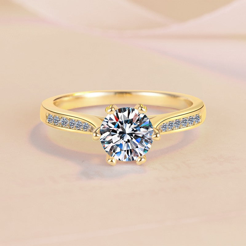 Damen Verlobungsring mit funkelndem rundem Zirkonia und luxuriösem Goldrahmen Shop Nory