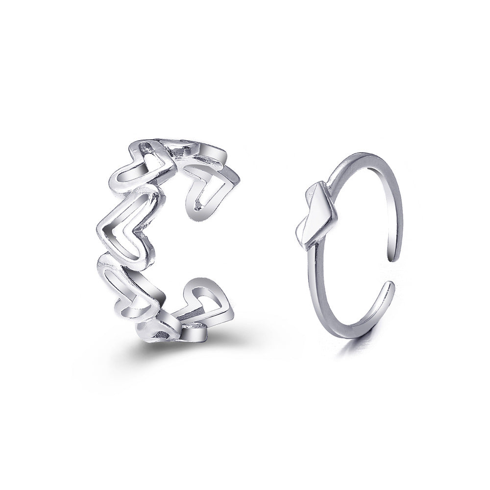 Damenring mit verspieltem Herzdesign und feinem Metallrahmen Shop Nory