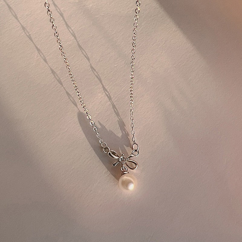 Damen Halskette mit eleganter Schleifen- und Perlenverzierung Shop Nory