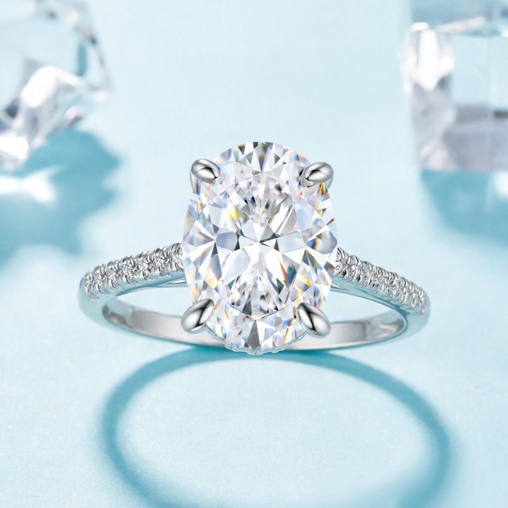 Damen eleganter Ring mit ovalem Hauptstein und feinem Zirkonia-Besatz Shop Nory