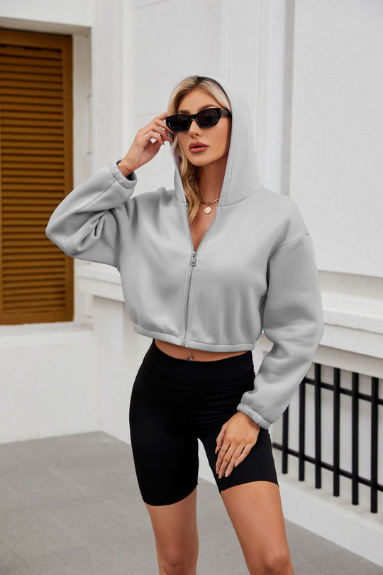 Damen Cropped Kapuzenjacke mit durchgehendem Reißverschluss und oversized Ärmeln Shop Nory