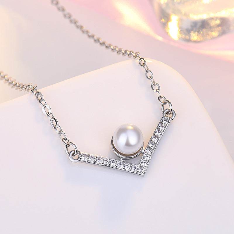 Damen Halskette aus hochwertigem Edelstahl mit eleganter Perle und funkelnden Zirkonia-Elementen Shop Nory