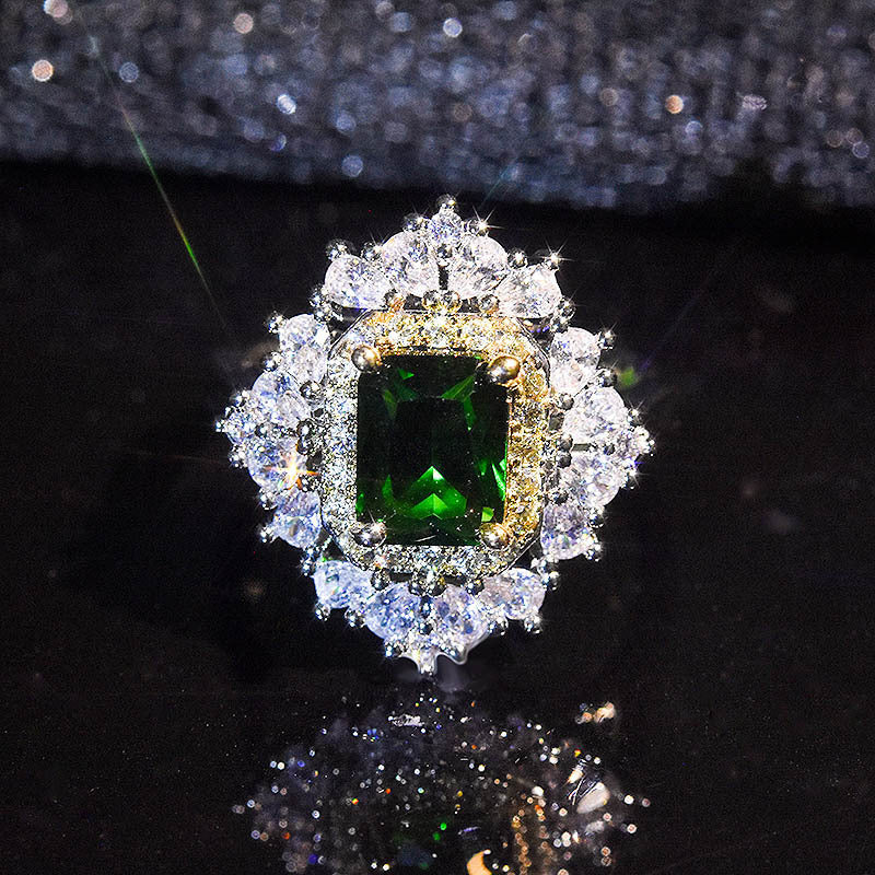 Damenring mit elegantem smaragdgrünem Edelstein und funkelnden Zirkonia-Steinen Shop Nory