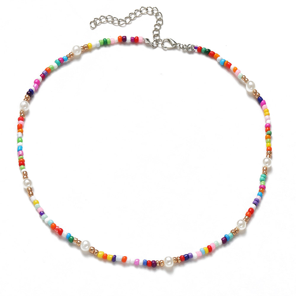 Damen Halskette mit bunten Blumenelementen und eleganten Perlen Shop Nory