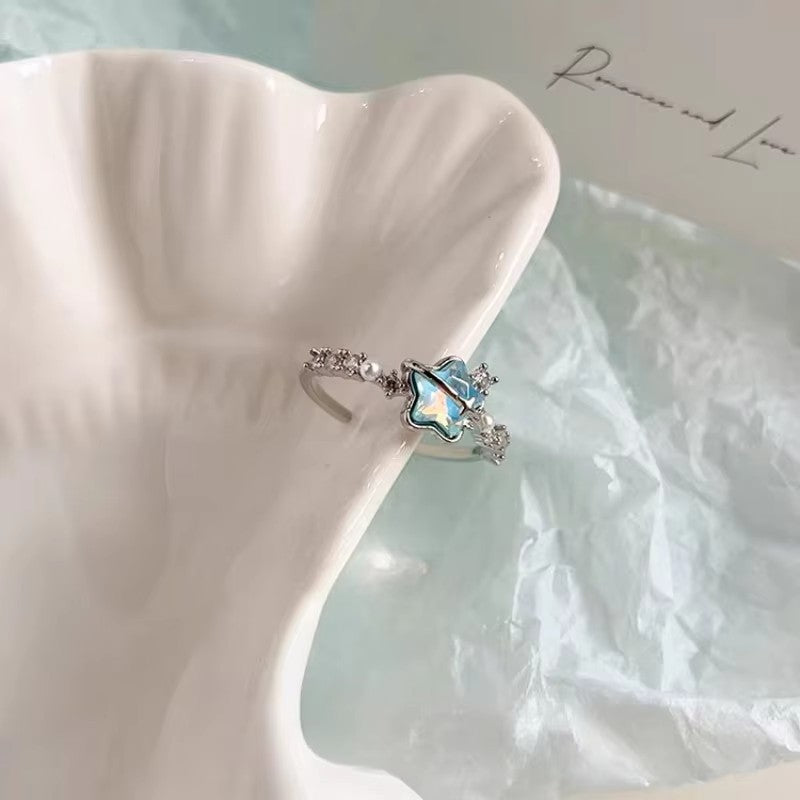 Damenring mit funkelndem Sternendesign und eleganten Perlenakzenten Shop Nory