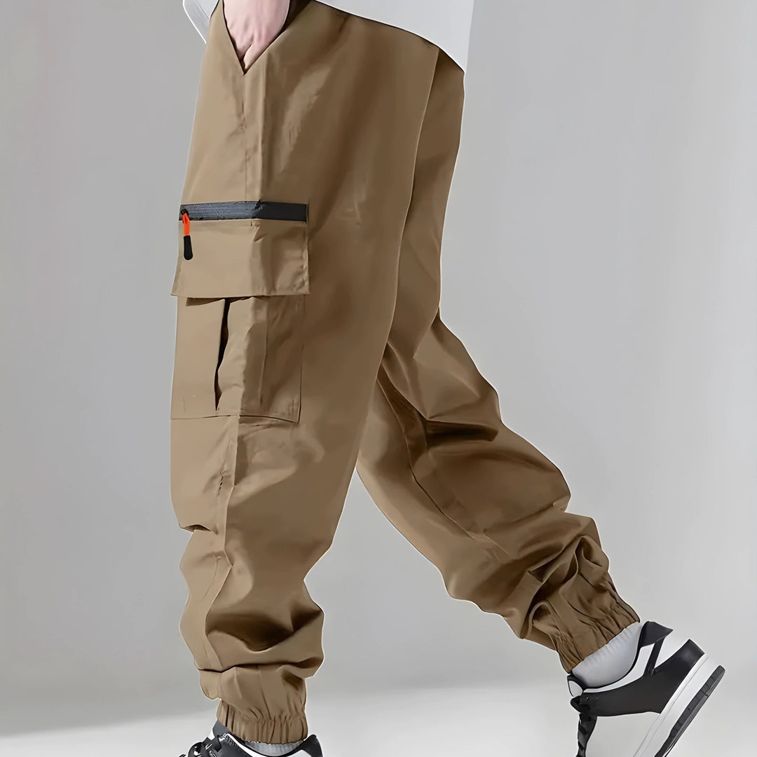 Herren Technische Cargo-Jogginghose mit Reißverschlusstaschen, Tunnelzug und elastischen Knöchelbündchen Shop Nory